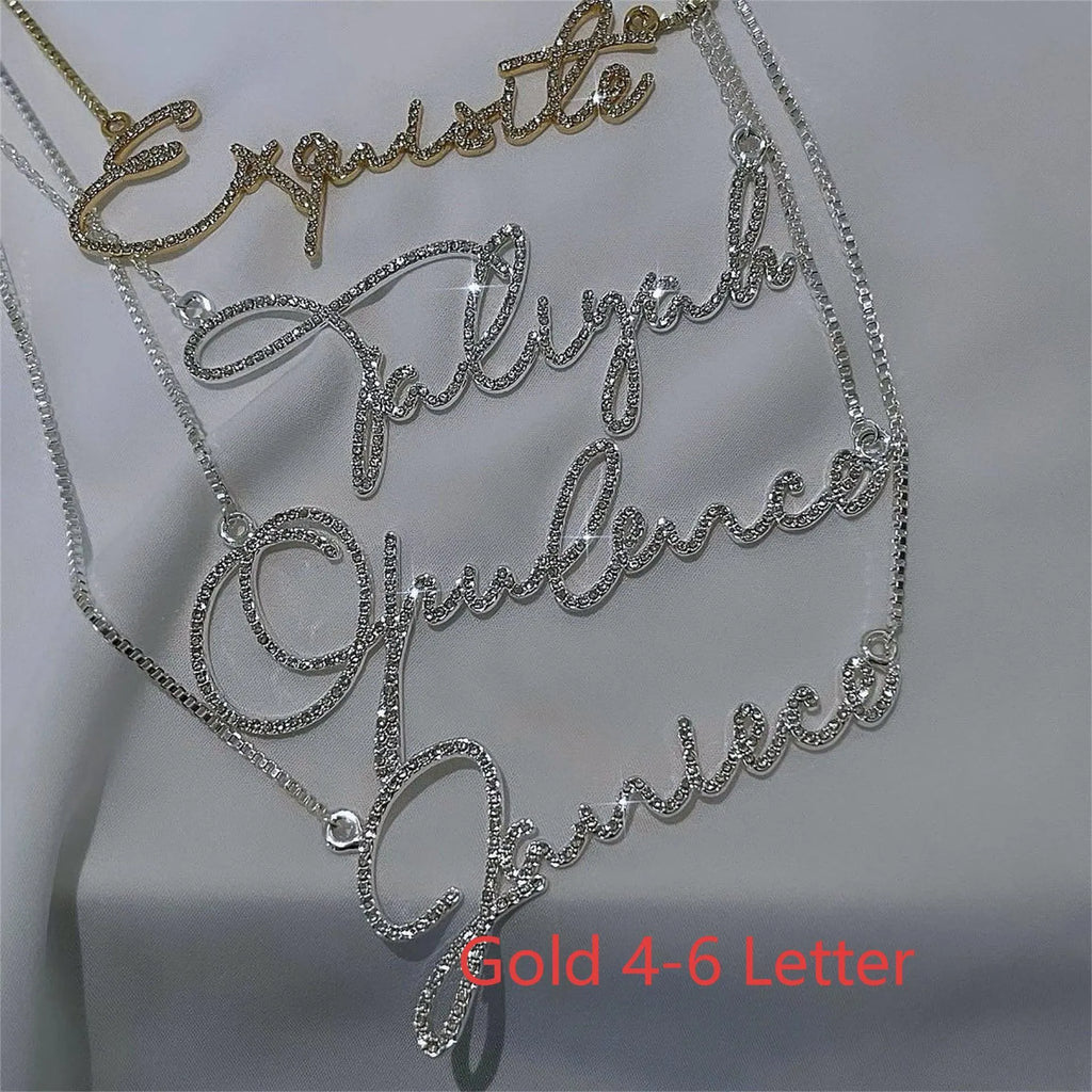 Personalised stainless steel name necklace with diamond-studded letters in silver, gold, or rose gold on a chain.