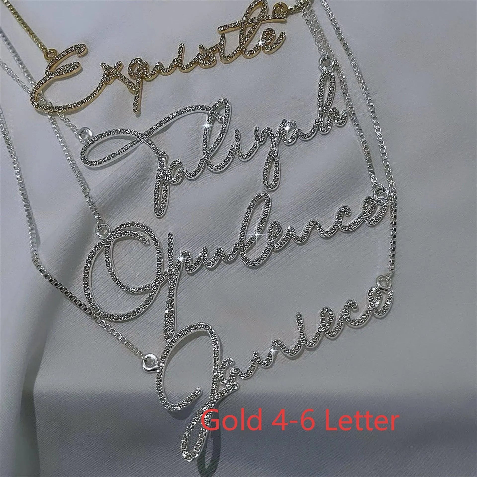 Personalised stainless steel name necklace with diamond-studded letters in silver, gold, or rose gold on a chain.