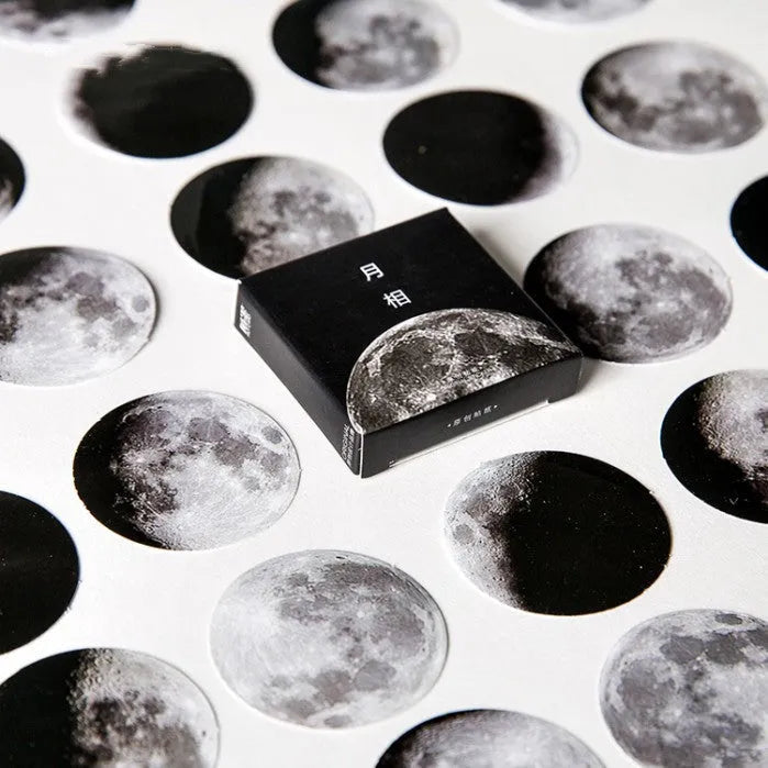 Boxed sheet of 45 black moon phase and calendar planet stickers on self-adhesive paper.