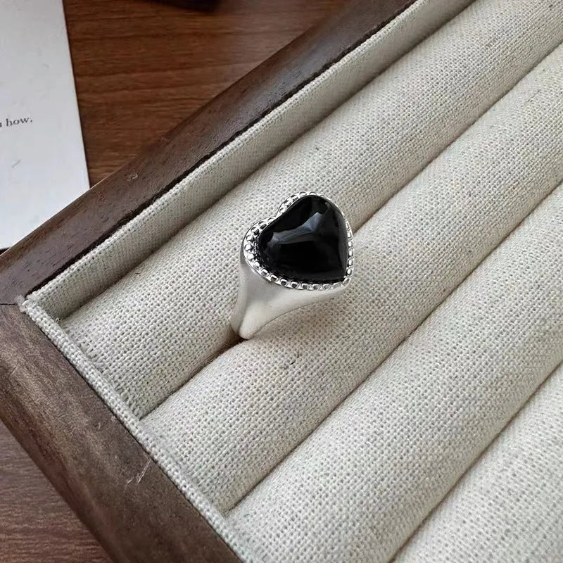 S925 sterling silver adjustable ring with black agate heart design in niche setting