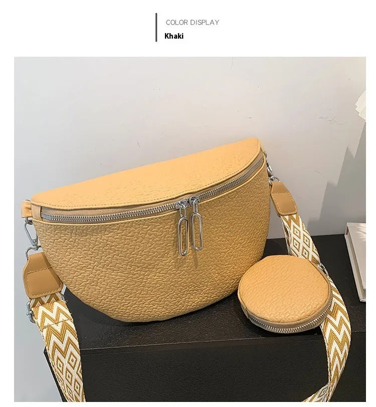 Women's solid colour textured PU crossbody bag with saddle lock hardware and clamshell opening