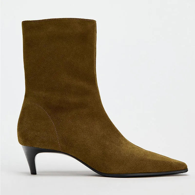 Brown square toe retro ankle boots with a side zip and a kitten heel on a waterproof platform sole.