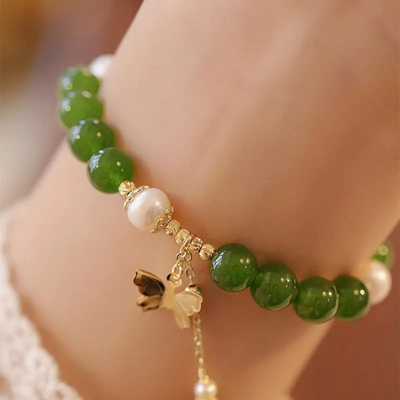 Women's natural green chalcedony bracelet with round geometric beads and handmade craft details
