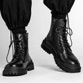 Men's black waterproof mid-top boots with rubber soles