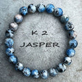 Handmade geometric bracelet made from blue K2 Azurite stone beads on a wrist.