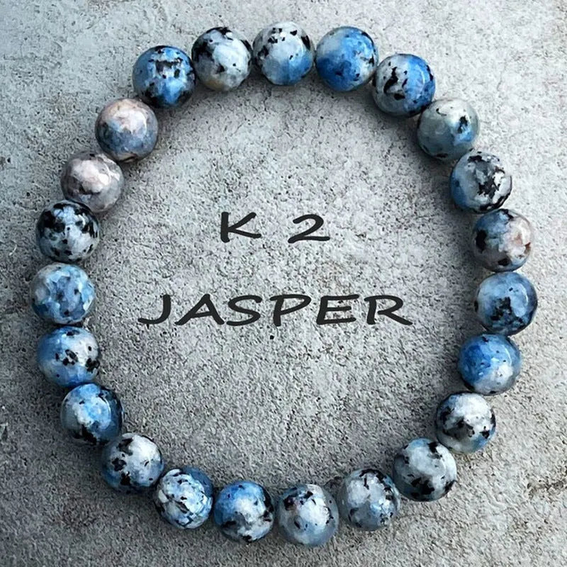Handmade geometric bracelet made from blue K2 Azurite stone beads on a wrist.