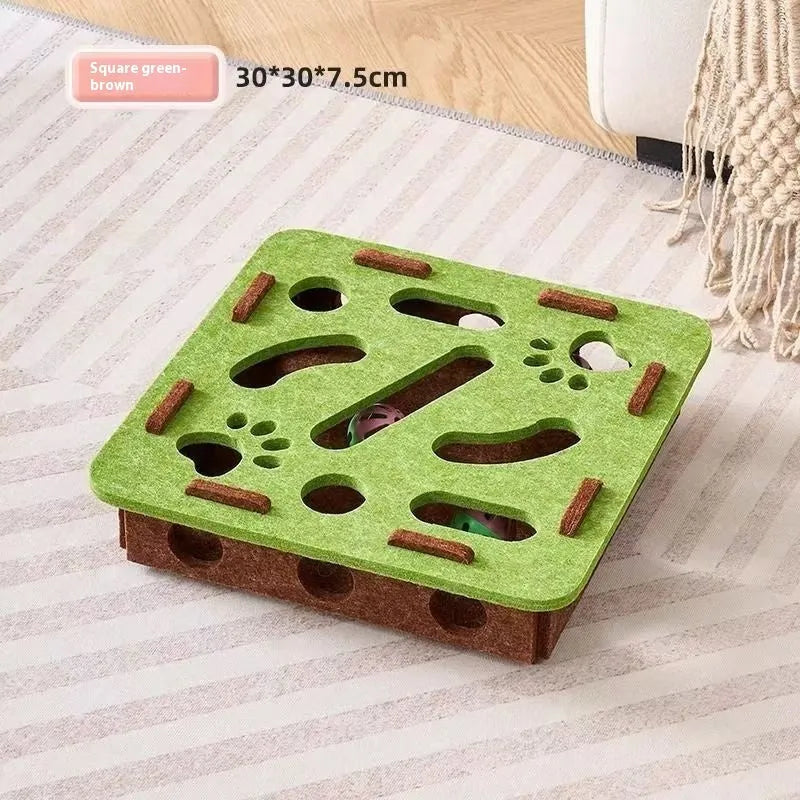 Green brown felt cat toy box with a felt mouse and a white feather ball inside.