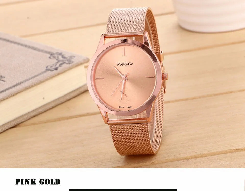 Unisex alloy mesh quartz watch with round silver case and dial on wrist