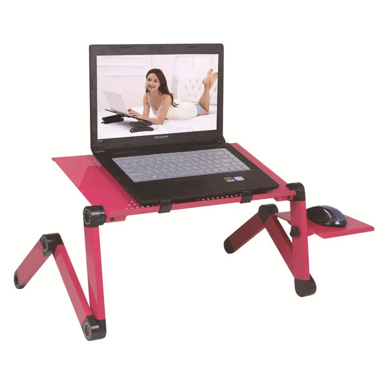 Black metal folding computer desk with cooling holes and mouse board deployed on sofa