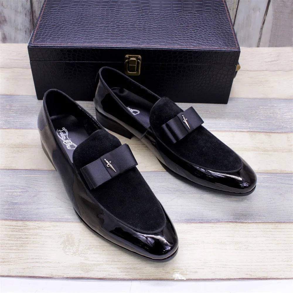 Men's black low-top leather brogue shoes with a patent leather finish and tassel detail on a rubber sole.