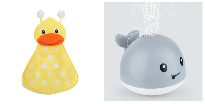 White and blue electric whale bath toy spraying water with flashing lights on a bathroom surface.