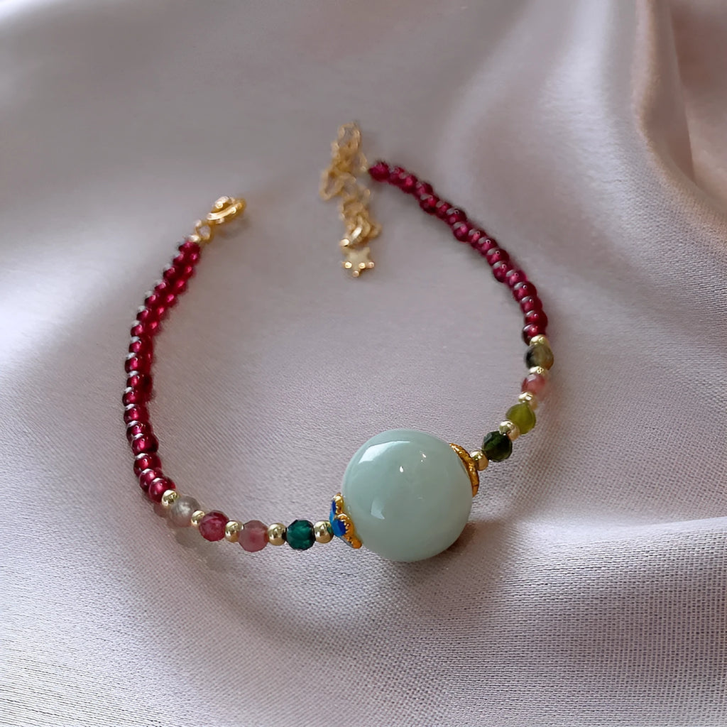 Aquamarine Chinese style garnet coloured tourmaline bracelet with a drop shape.