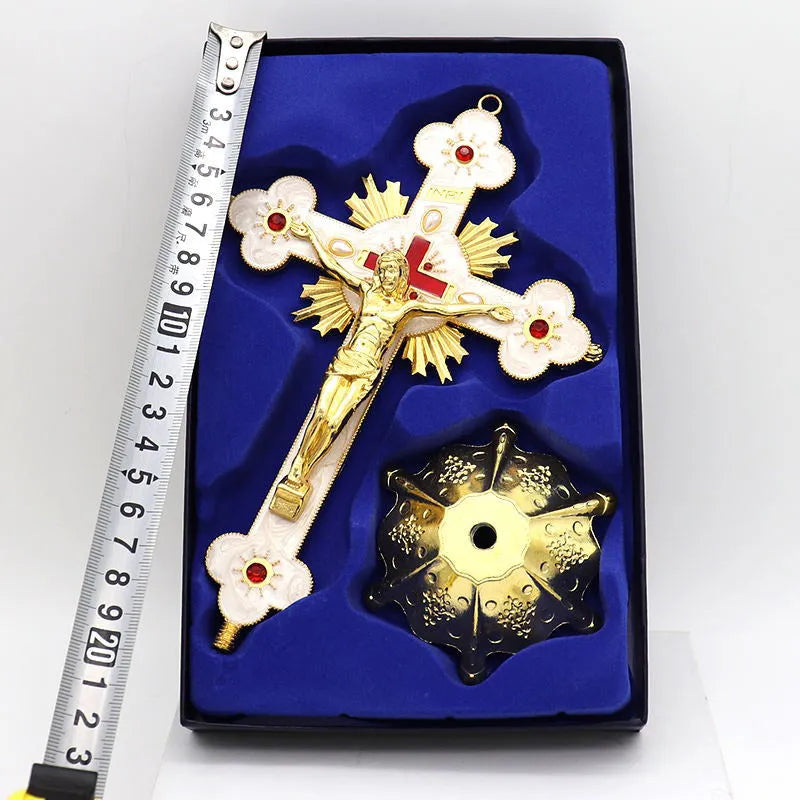 Gold geometric zinc alloy car ornament with micro-inlaid design on a desktop.