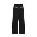 Women's beaded round-neck top and high-waisted trousers co-ord set in a contrast colour.