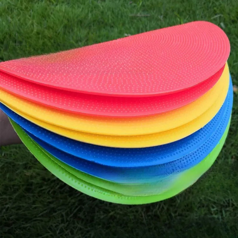 Yellow TPE football landmark pad disc on grass, 23cm diameter flat sports training marker.