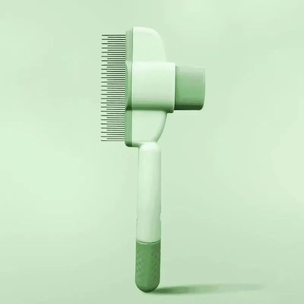 Green and yellow pet grooming brush with one-click hair removal and silicone bristles for dogs