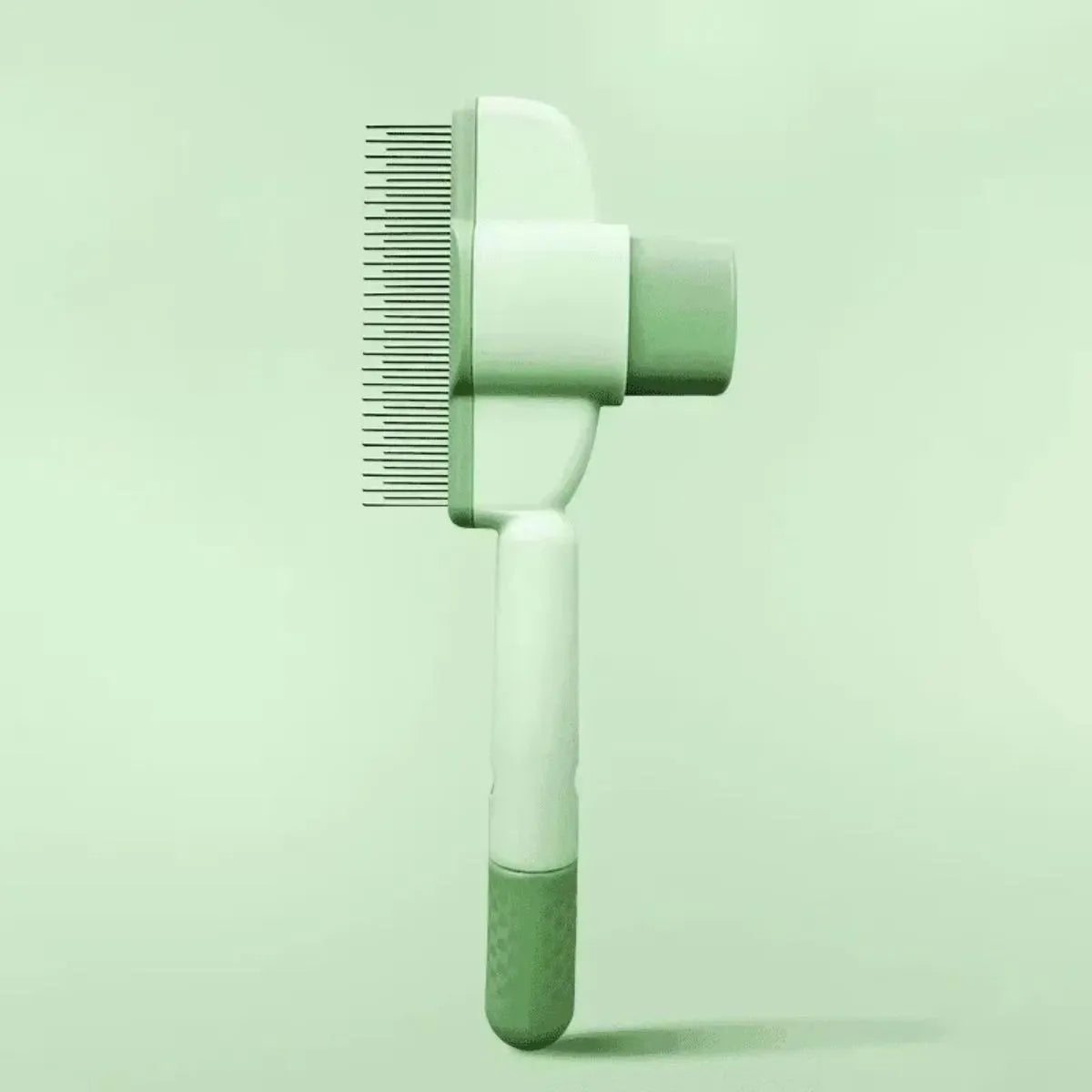 Green and yellow pet grooming brush with one-click hair removal and silicone bristles for dogs