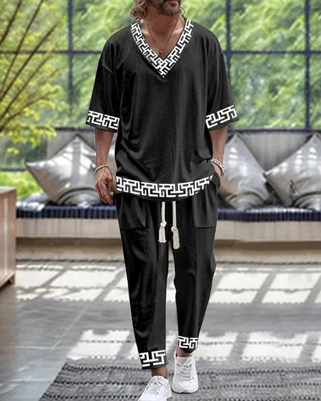 A women's polyester trousers suit set with a V-neck cropped sleeve jacket and matching trousers.