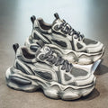 Men's black mesh sports sneakers with a platform sole and lace-up front, shown on a white background.