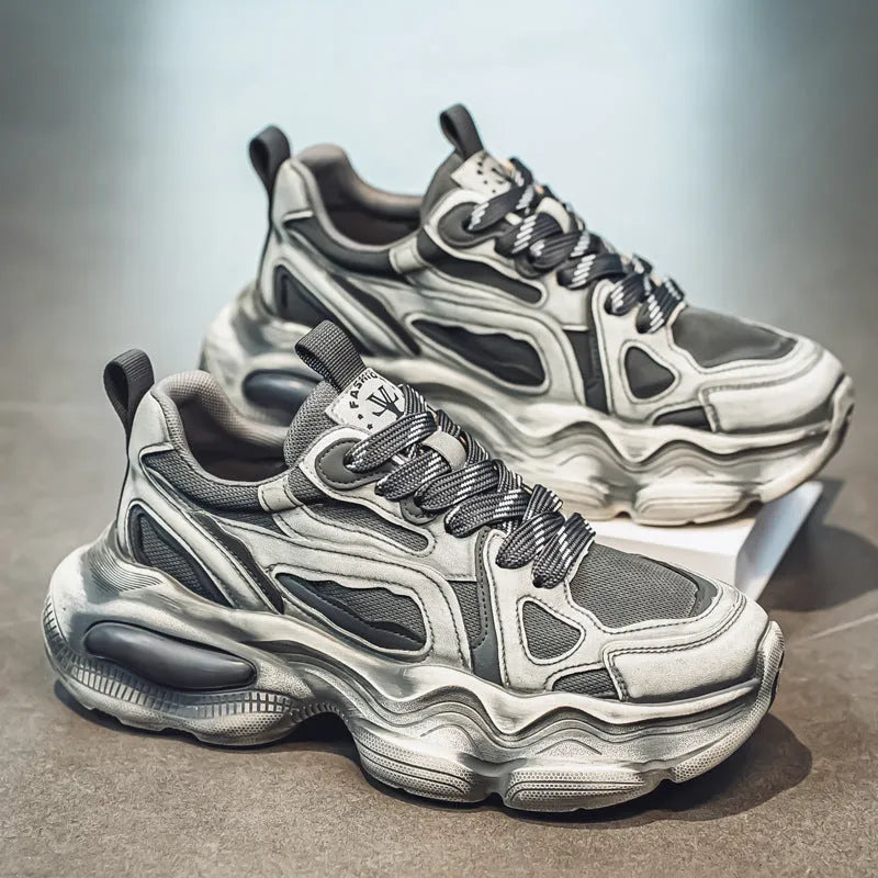 Men's black mesh sports sneakers with a platform sole and lace-up front, shown on a white background.