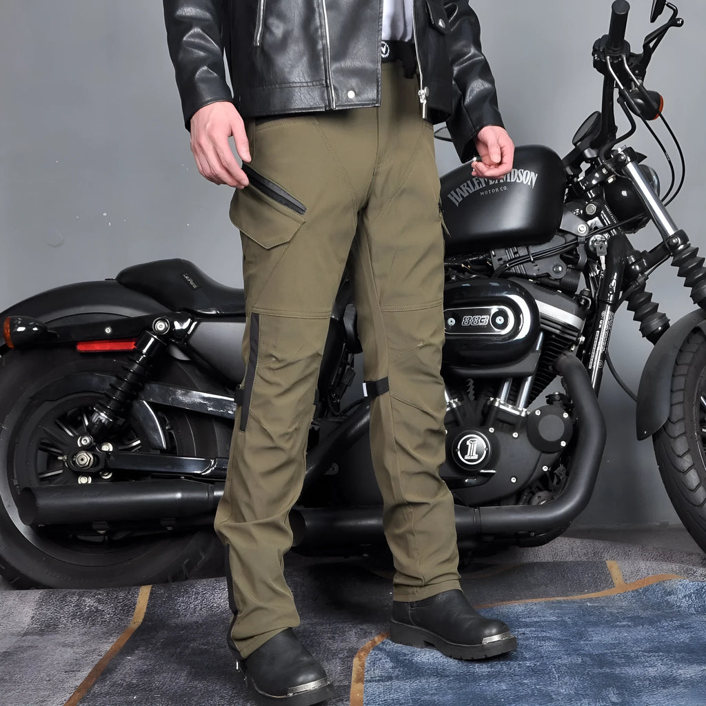 Men's solid green waterproof motorcycle cycling pants laid flat, showing belt and protective gear set.