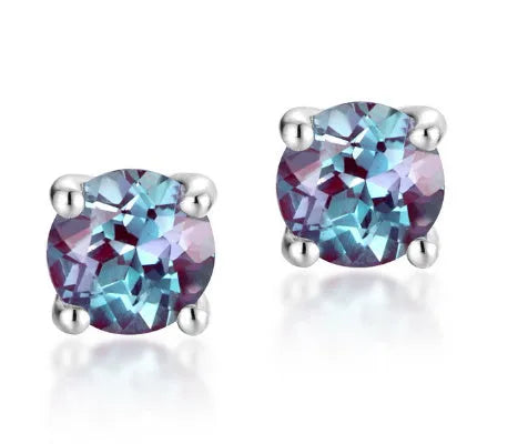 A pair of sterling silver geometric circle ear studs with a cultivated alexandrite stone.