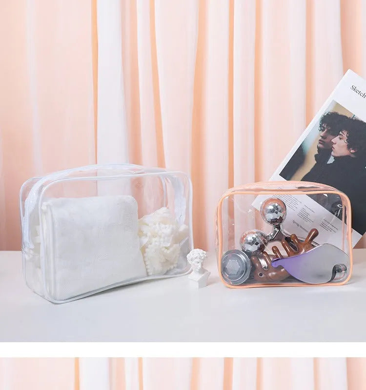 Set of three semi-transparent PVC makeup bags in pink with Labubu stickers, showing large and extra-large sizes.