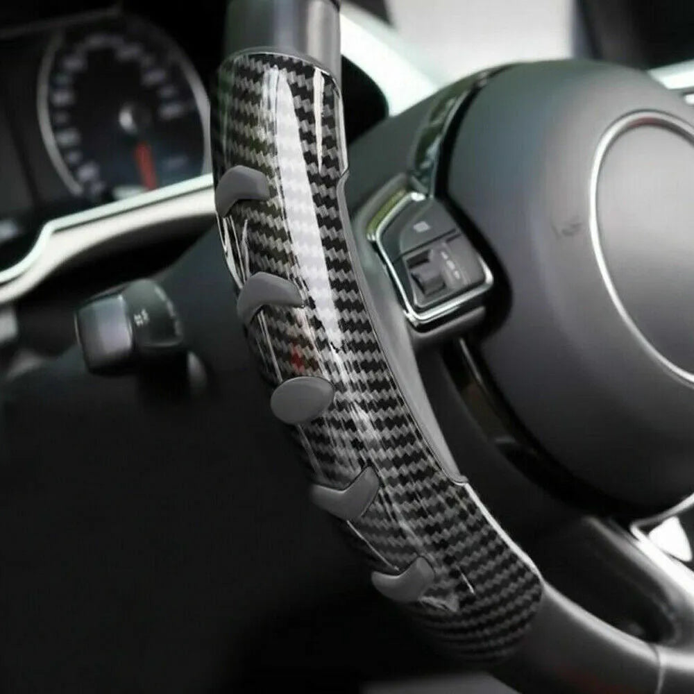 Carbon fibre black anti-skid steering wheel sleeve for cars with a 38cm diameter.