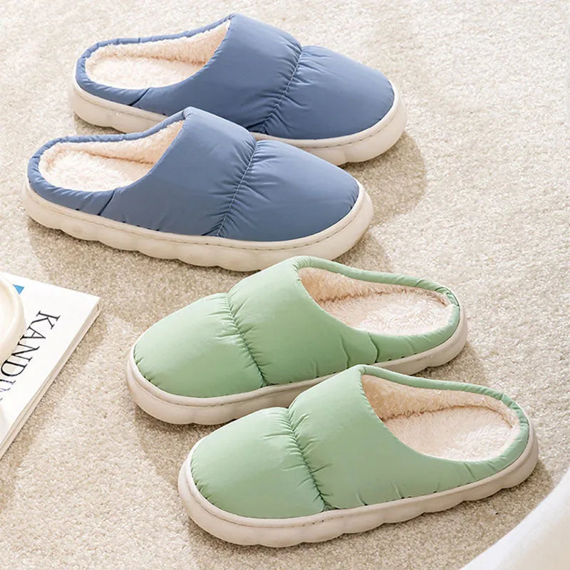 Down cotton house slippers with artificial leather upper, rubber sole, and plush lining in blue colour