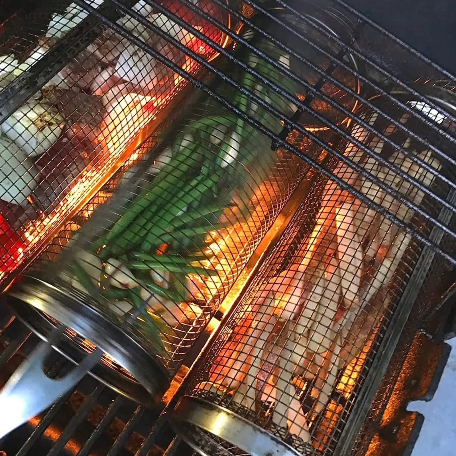 Stainless steel rolling barbecue grill basket with mesh cylinder for cooking vegetables and meatballs