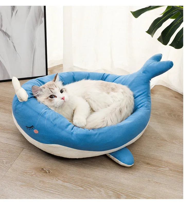 Blue duck-shaped fluffy pet bed sofa for a small dog, showing raised sides and soft material.
