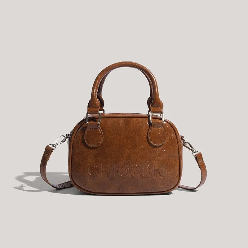 Retro PU crossbody bag with letter and stitching details in horizontal square shape, black colour