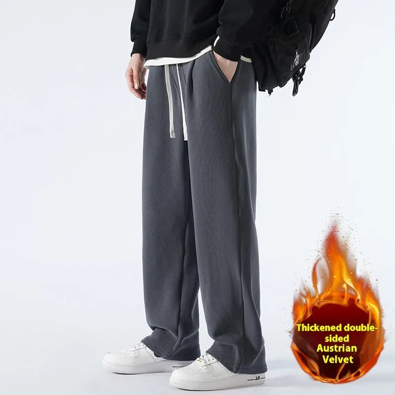 Man wearing apricot coloured double-sided polar fleece winter trousers with a loose fit and drawstring waist.