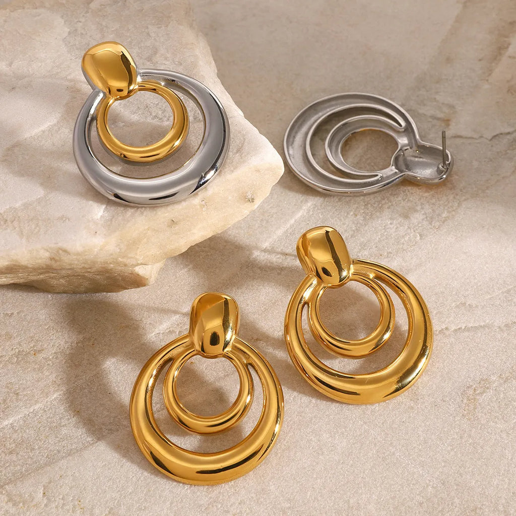 Gold geometric titanium steel stud earrings with double layer hollow round design