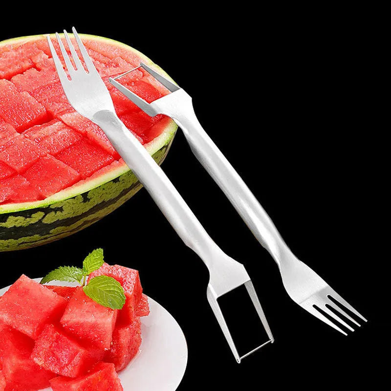 Silver stainless steel watermelon slicer and serving fork on a kitchen counter