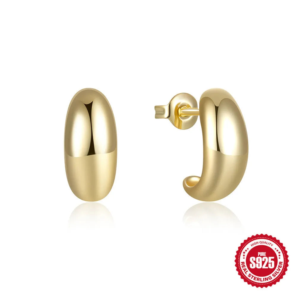 A single glossy C-shaped sterling silver stud earring on a white background.