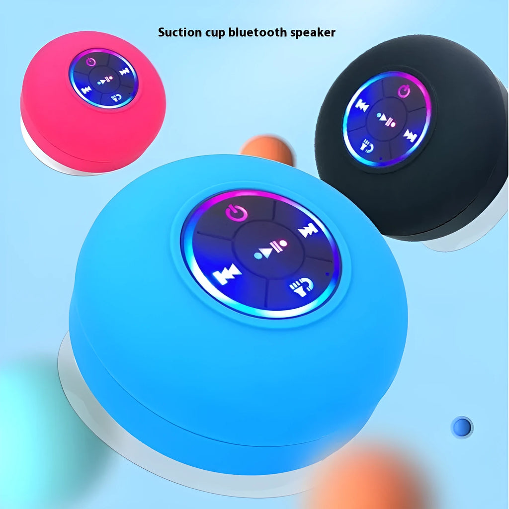 Large white waterproof Bluetooth speaker with a suction cup base and built-in LED light