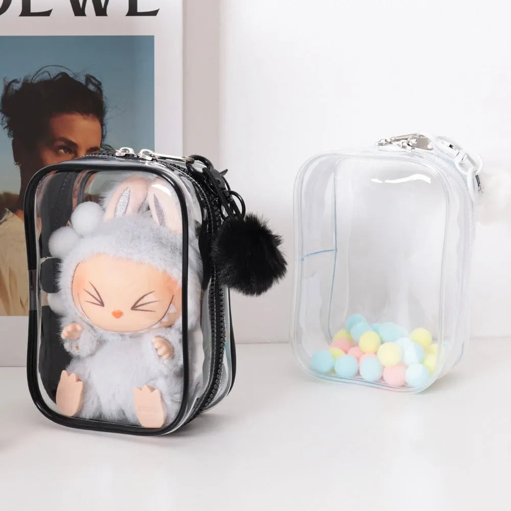 Set of three semi-transparent PVC makeup bags in pink with Labubu stickers, showing large and extra-large sizes.