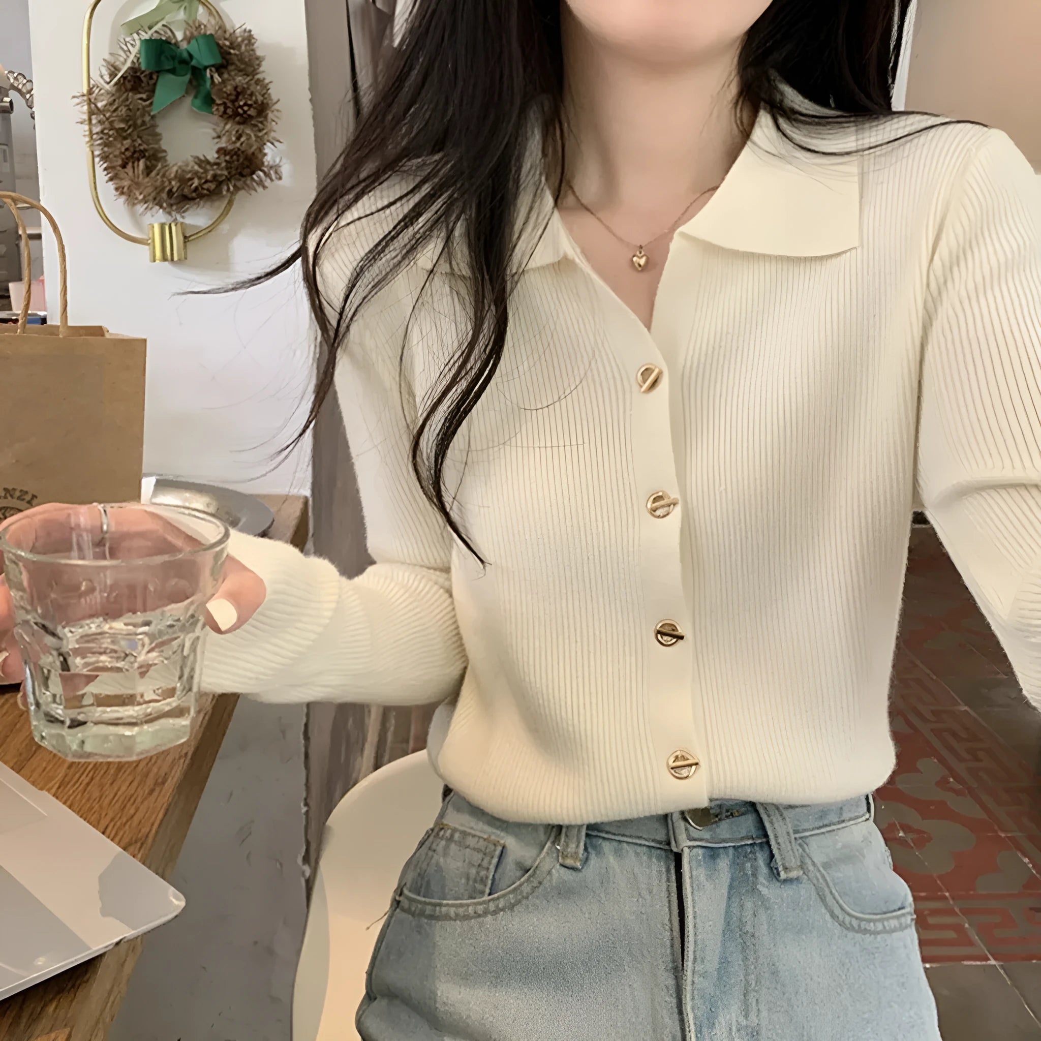 Long-sleeved loose-fitting viscose cardigan top in beige, shown worn open over a top