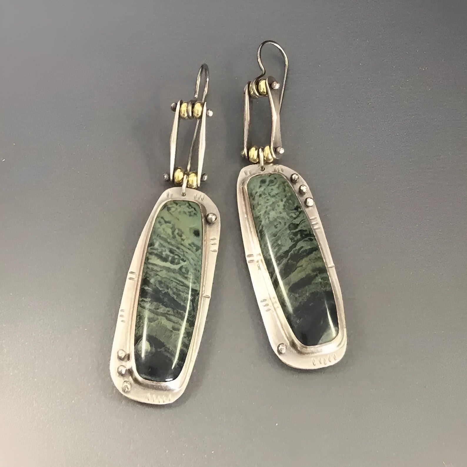 Geometric alloy earrings with two-colour marble pattern and simple styling