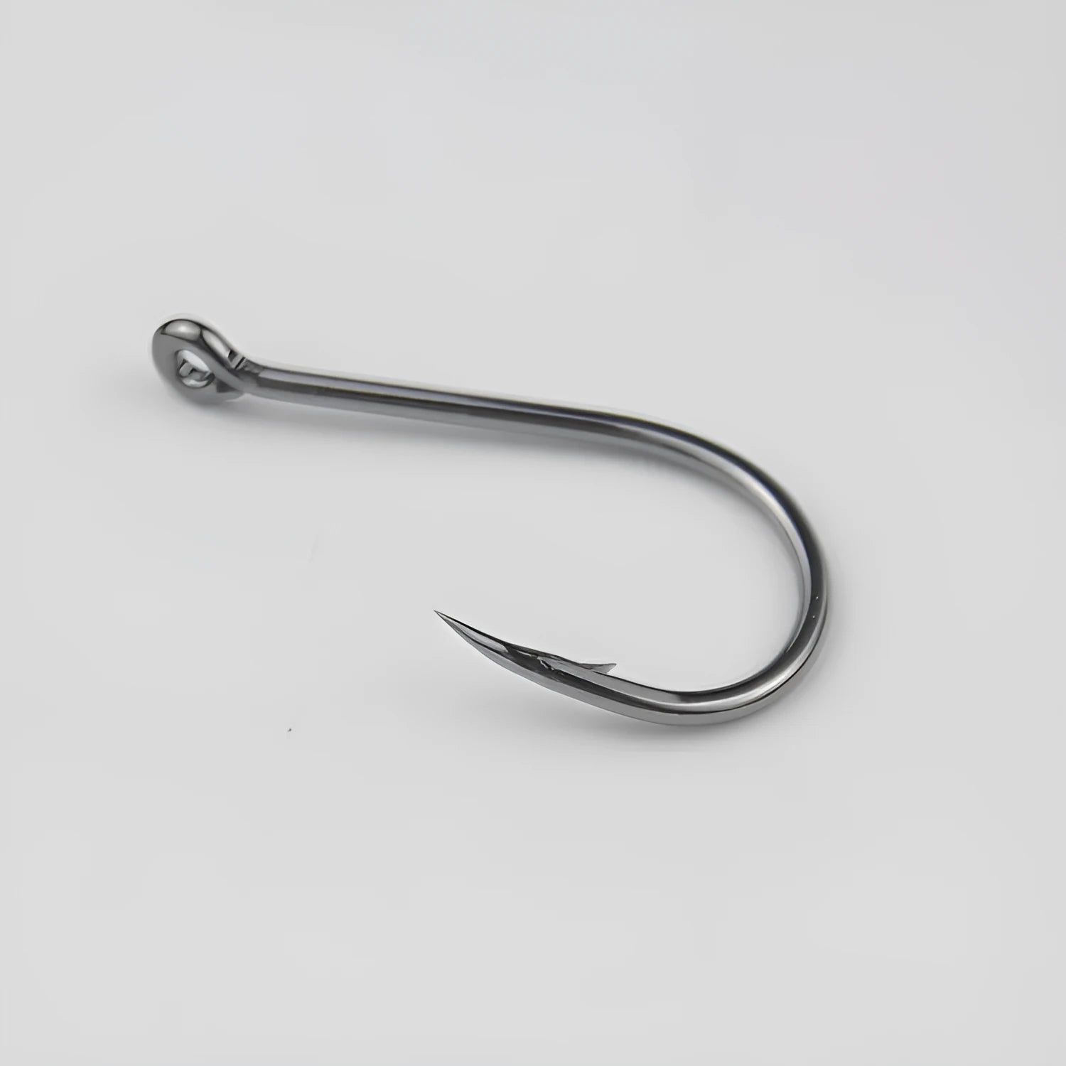 Bulk pack of alloy carbon steel barbed fishing hooks in various sizes for sea and rock fishing.