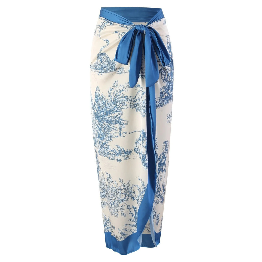 Blue women's one-piece polyester swimsuit with a separate matching gauze skirt.