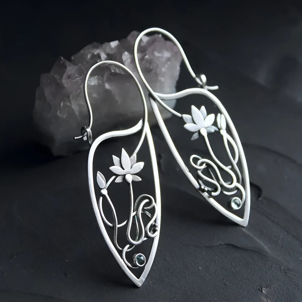 Silver lotus flower vine earrings with geometric rhinestone accents and retro styling
