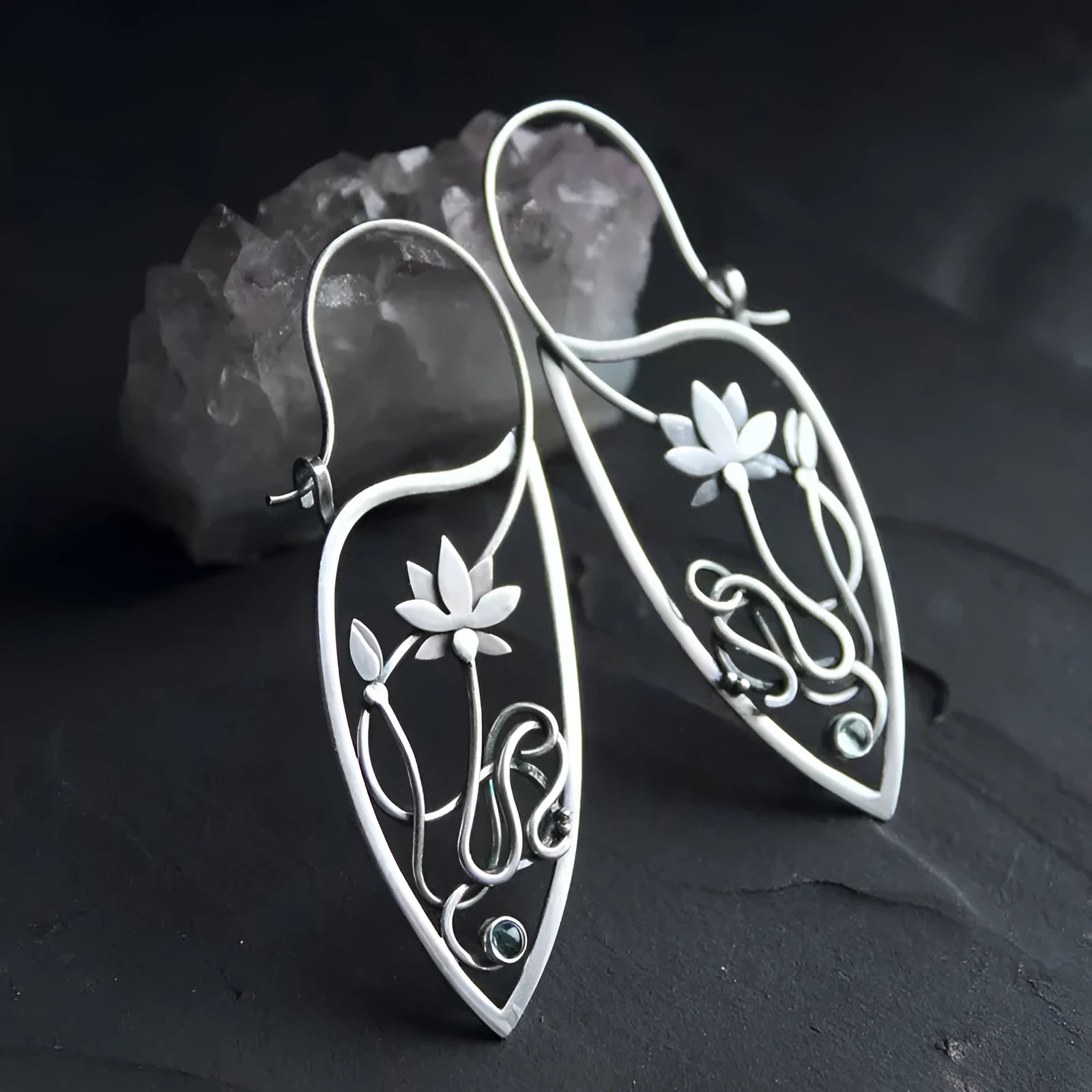 Silver lotus flower vine earrings with geometric rhinestone accents and retro styling