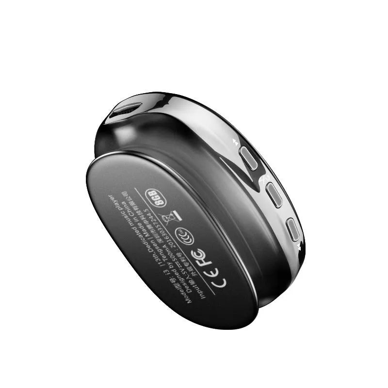 Blue Bluetooth MP4 music player with OLED display showing track info, placed next to headphones.