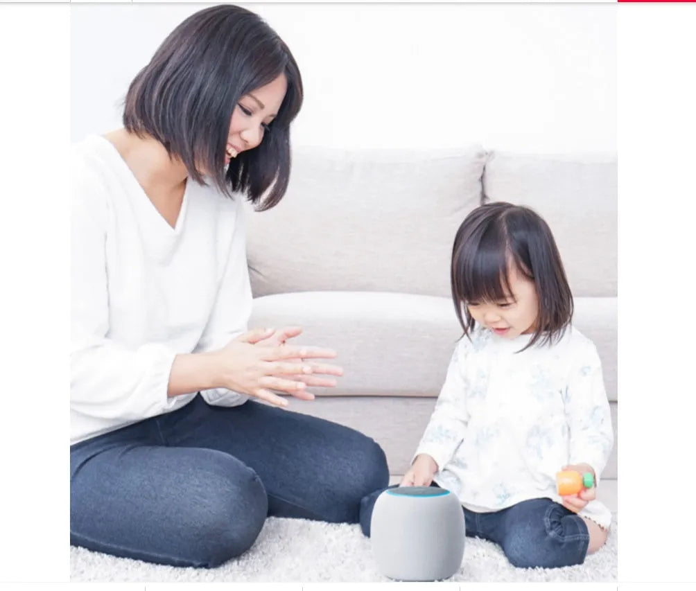 Compact mini AI voice assistant Bluetooth smart speaker with six microphones and control buttons.