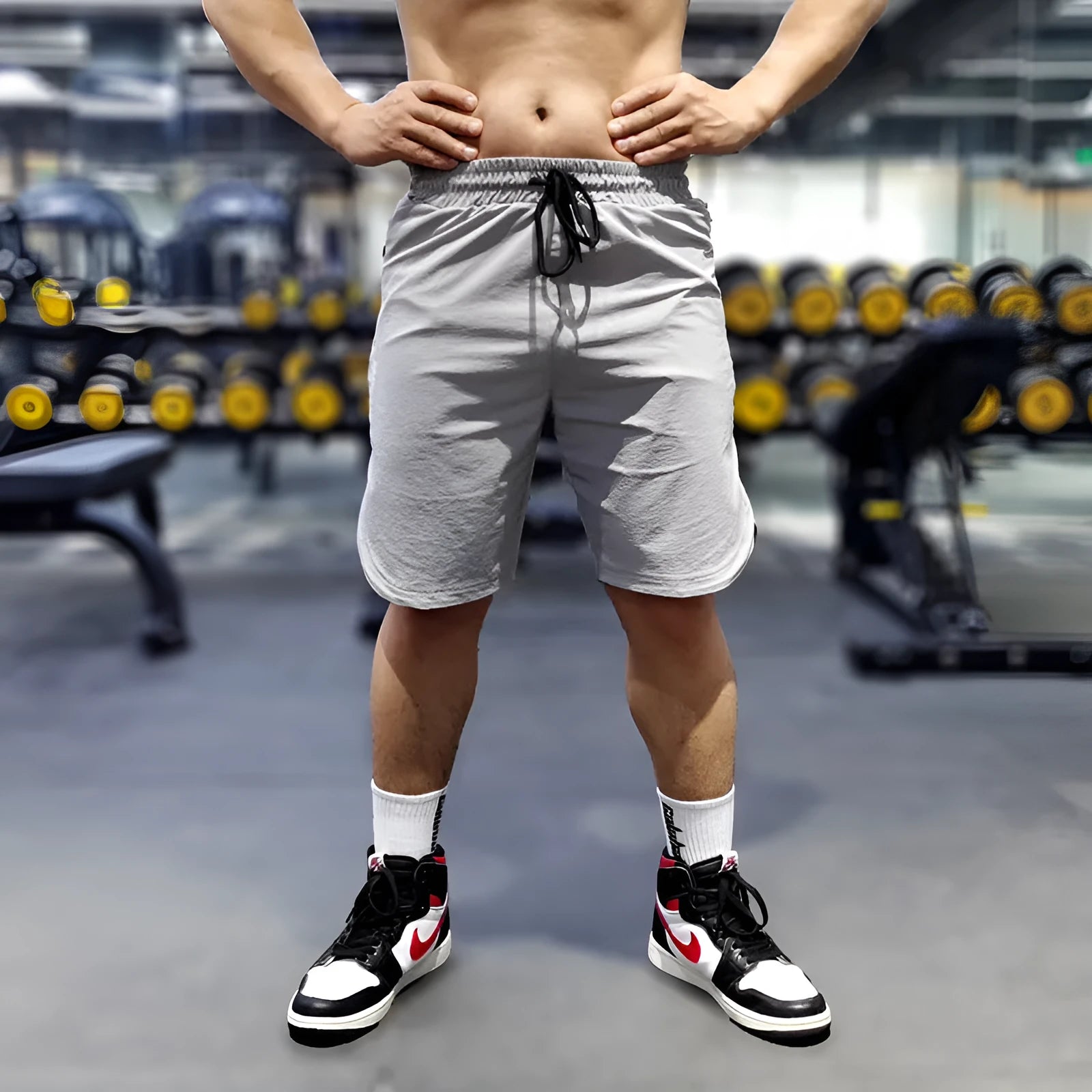 Men's black quick-drying sports running shorts with contrast side panels, shown in a size L.