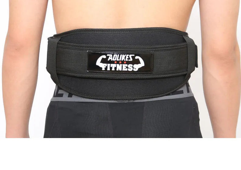 Black nylon fitness weightlifting waistband with adjustable hook and loop closure laid flat.