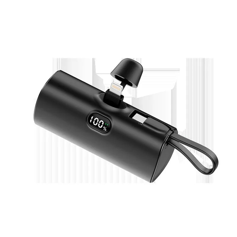 Compact capsule-shaped power bank in various colours showing digital display and built-in plug.