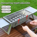 Small portable charcoal grill with foldable legs, shown collapsed for storage.